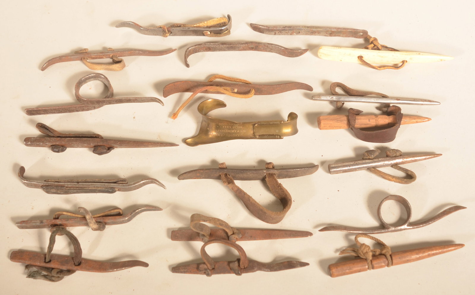 Collection 20 Corn Huskers Incl. Signed Brass 1882: Collected here in Lancaster County, Pa. Group includes huskers made from bone, wood, brass, wrought iron and steel. The brass husker is signed "Universal Husker Pat Feb 21 1882 A.W. Brinkerhoff & Son