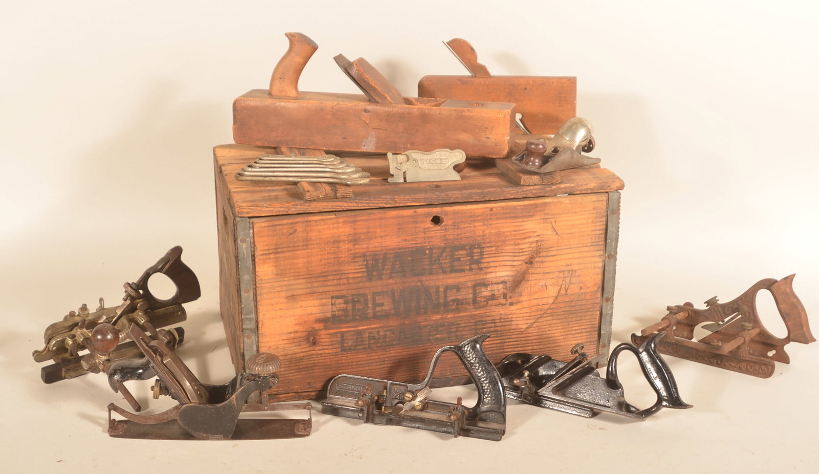 Collection Stanley, Union & Unsigned Planes: Collection of nine planes and a set of "Auto-Kit" hand wrenches all found in a Wacker Brewing Co, Lancaster, Pa. beer crate. There is one wood plane that is unsigned and one wood plane signed
