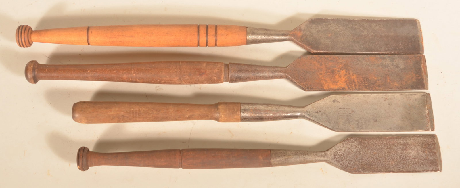 Group Woodworking Slicks: Four woodworking slicks. Three unsigned and one stamped "Glider Hill Cast Steel". Longest, 32"L