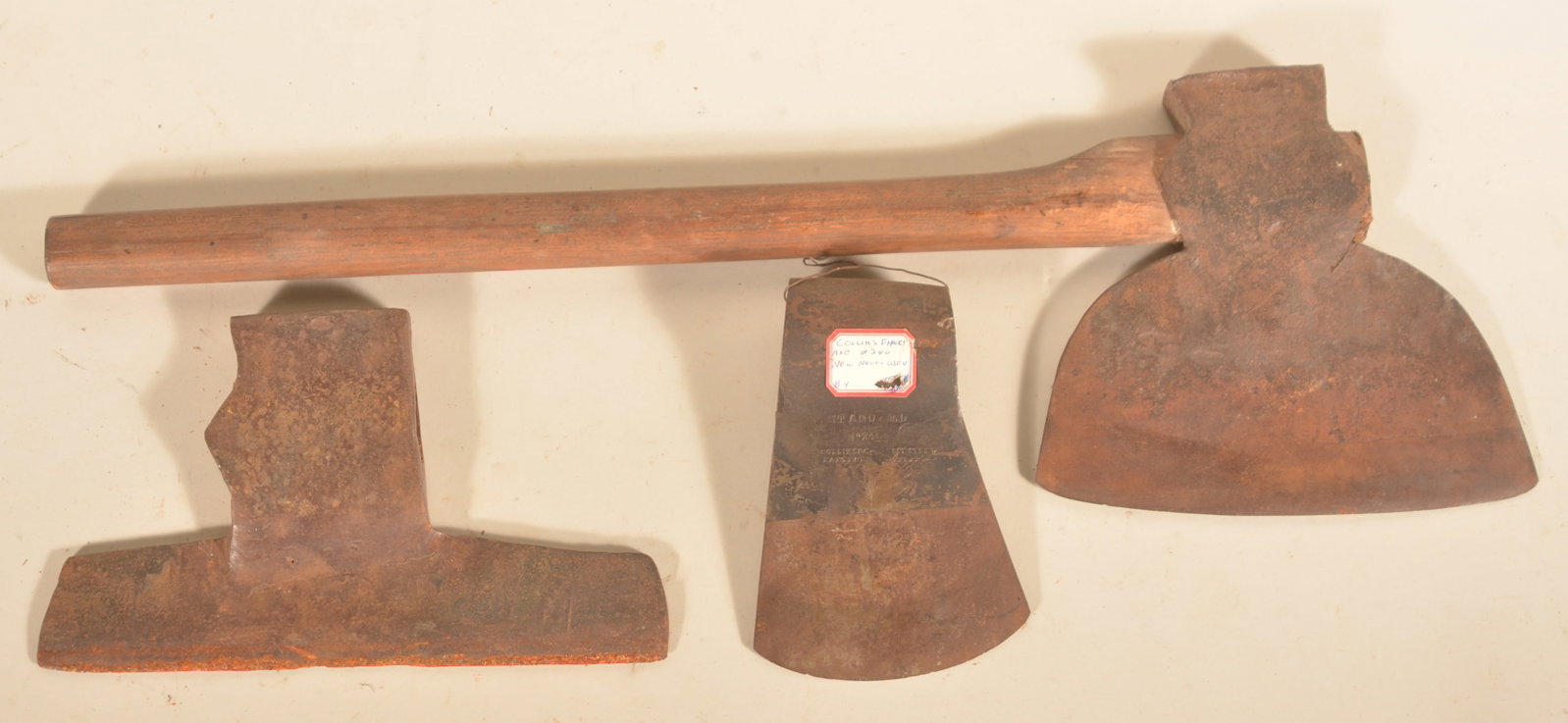 Two Pennsylvania Broad Axes & Signed Felling Axe: Two 19th-century broad axes, both unsigned and one missing handle. Felling axe head signed "Standard No 24 Collins & Co Cast Steel Hartford Warranted". Three axes total. Broad axe with handle, 31"L