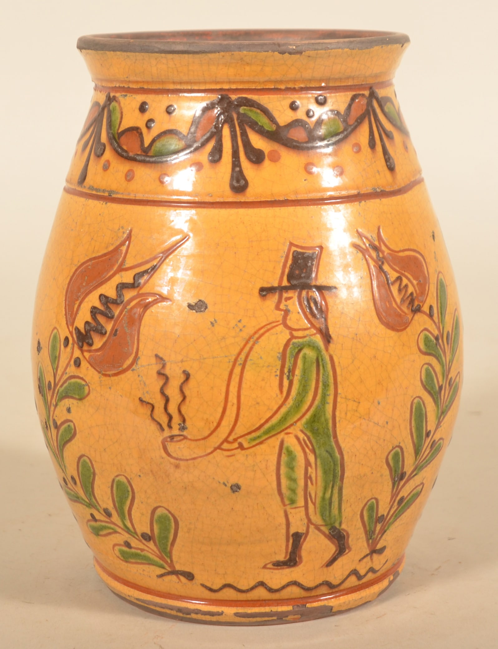 Greg Shooner Sgraffito Redware Jar: As is typical for Greg, a wonderful jar with faux crazing and age featuring a woman holding a tulip and a man with a long pipe. Signed on base and dated 2000. 8 1/2"H