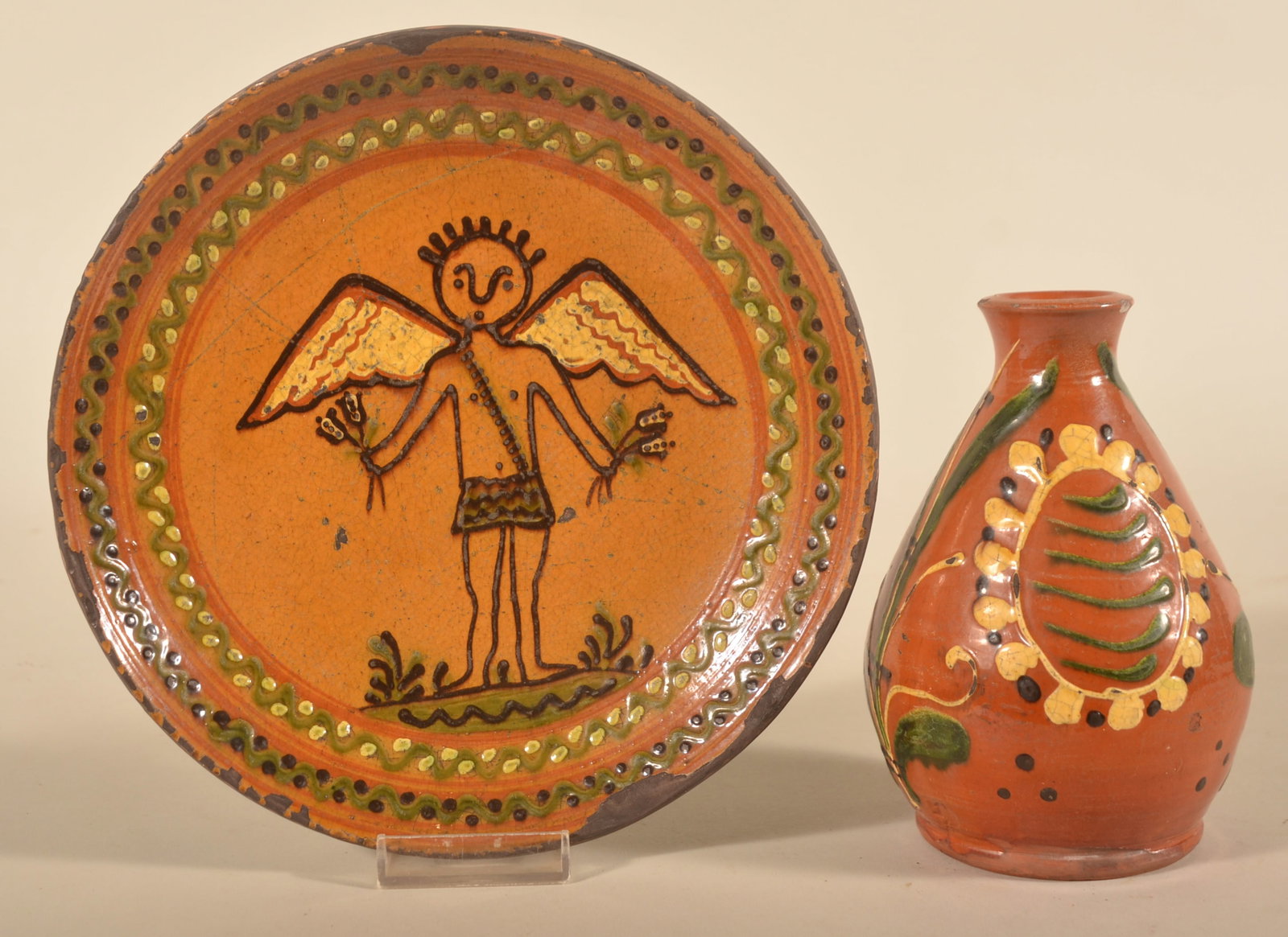 Mary & Greg Shooner Redware Plate & Vase: Sgraffito plate signed on back by Mary and dated 2003. Together with a small vase signed by Greg and dated 1994. Plate, 8 1/2"D
