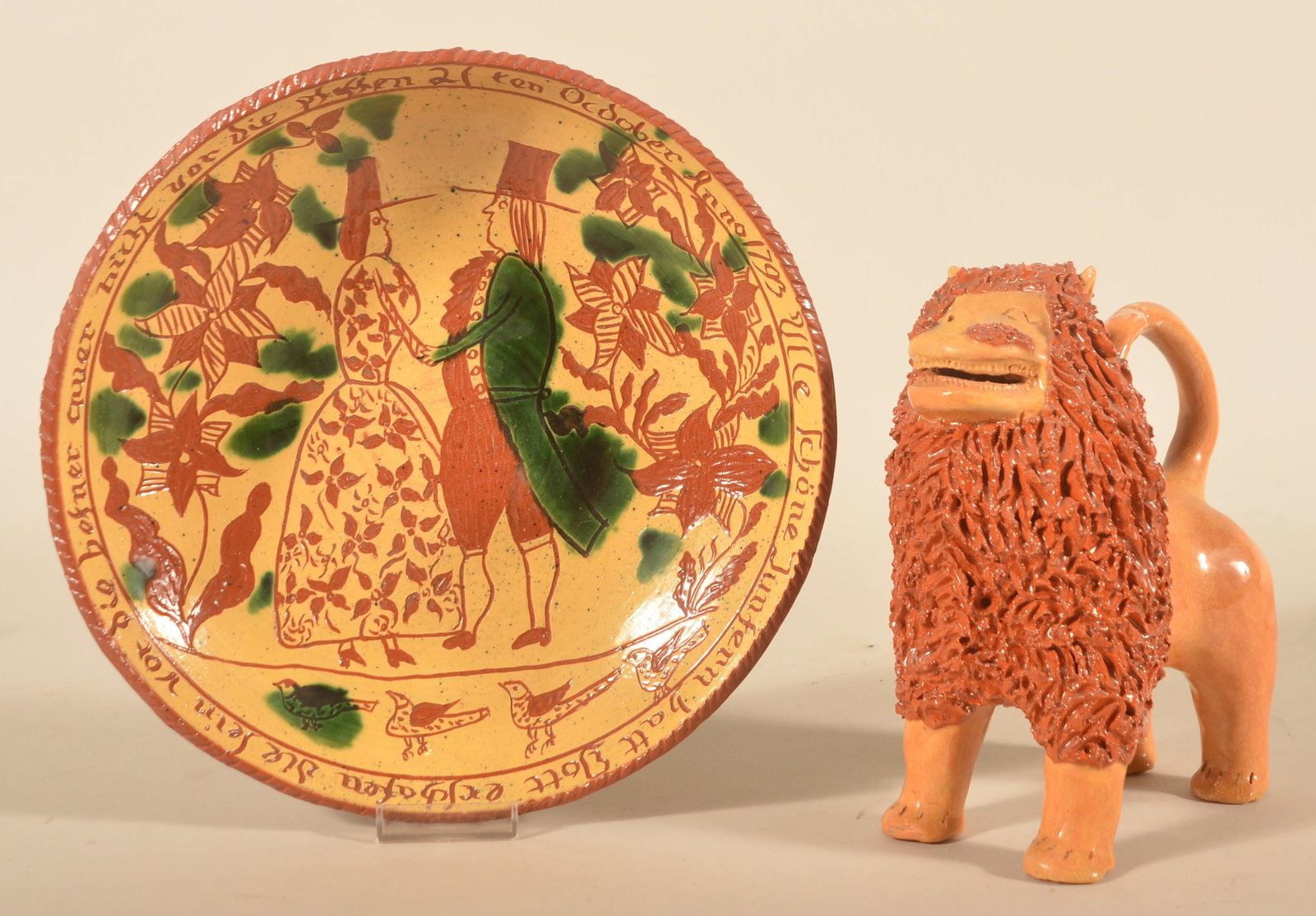 Dorothy Long Sgraffito Plate & John Bell-Type Lion: 10 3/4" sgraffito plate featuring a man and woman dancing at their wedding and patterned after an original plate in the collection of the Philadelphia Museum of Art. Signed Dorothy E. Long Wayne,
