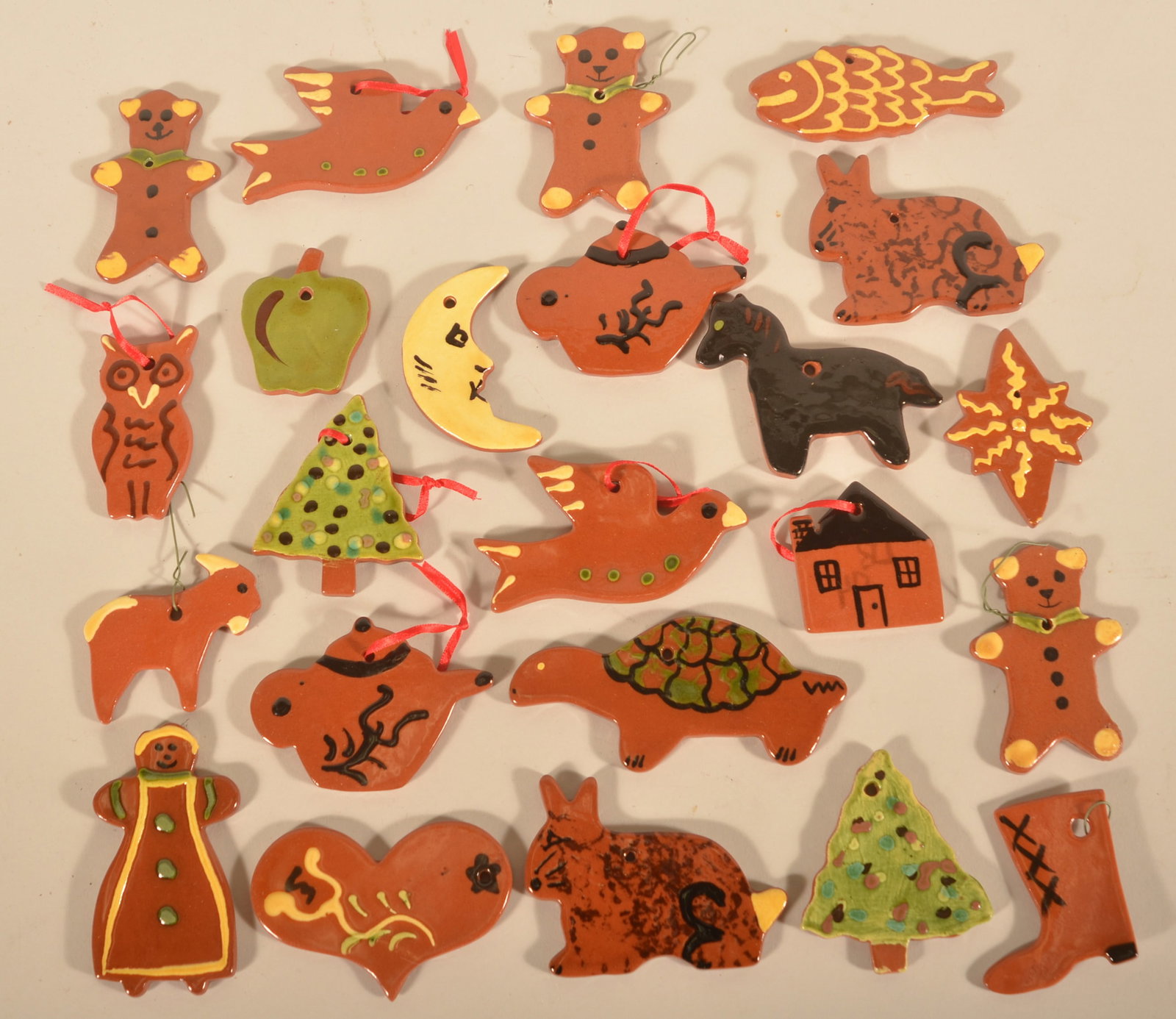 23 Lester Breininger Redware Christmas Ornaments: Initialed on the back with dates from the 1970s to 1994. Each, 3"W