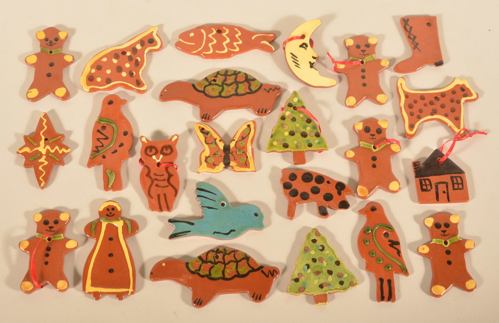 Lester Breininger Redware Christmas Ornaments: Collection of 23 ornaments, each initialed on the back with dates ranging from 1977 to 1994. Each, 3"W