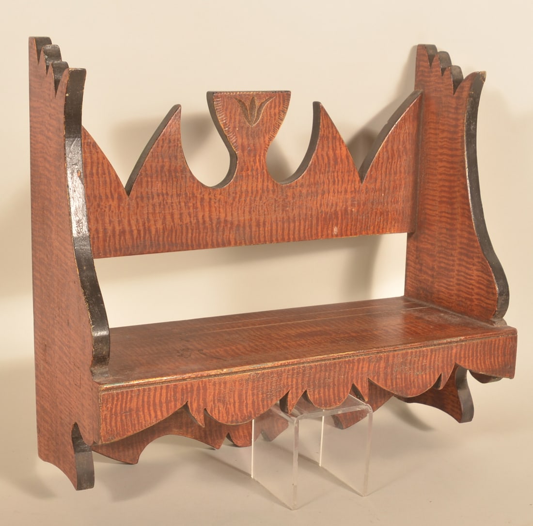 Folky Tulip Carved & Paint-Decorated Hanging Shelf: Beautiful form and decoration on this 19th-century hanging shelf. The shelf is made of thick pine and is square nailed. There is a carved tulip in the center with additional carving around the edges s