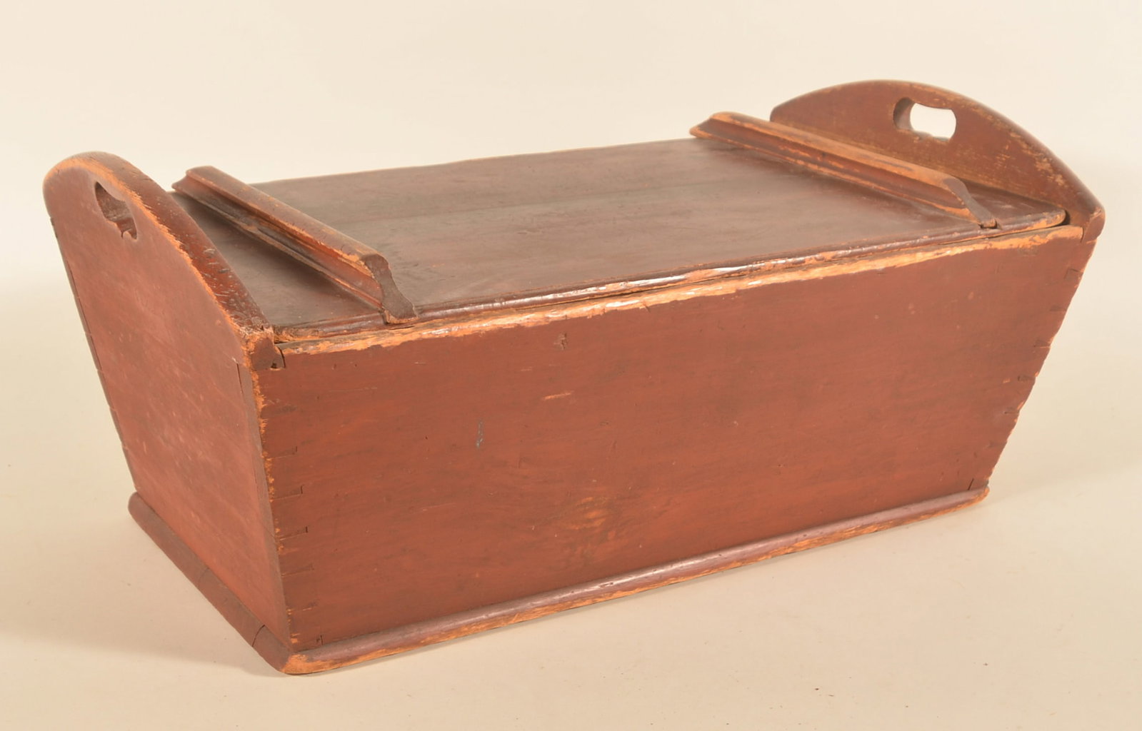 Pennsylvania Red-Painted Dovetailed Dough Box: Ca. 1840 original red paint, with wonderful heart cut-out handles on each end. Great wear and look. 12"H x 28 1/4"W x 15 1/2"D
