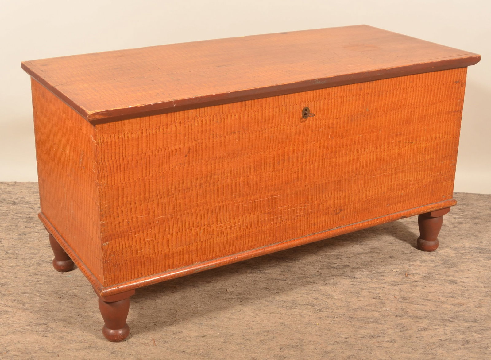 Comb-Painted Manheim, PA Dovetailed Blanket Chest: Beautiful paint and strong condition. This red and mustard comb paint trimmed in red is seen on blanket chests originating in the Manheim area of Lancaster County. Ca. 1840-1850. Pine with interior ti