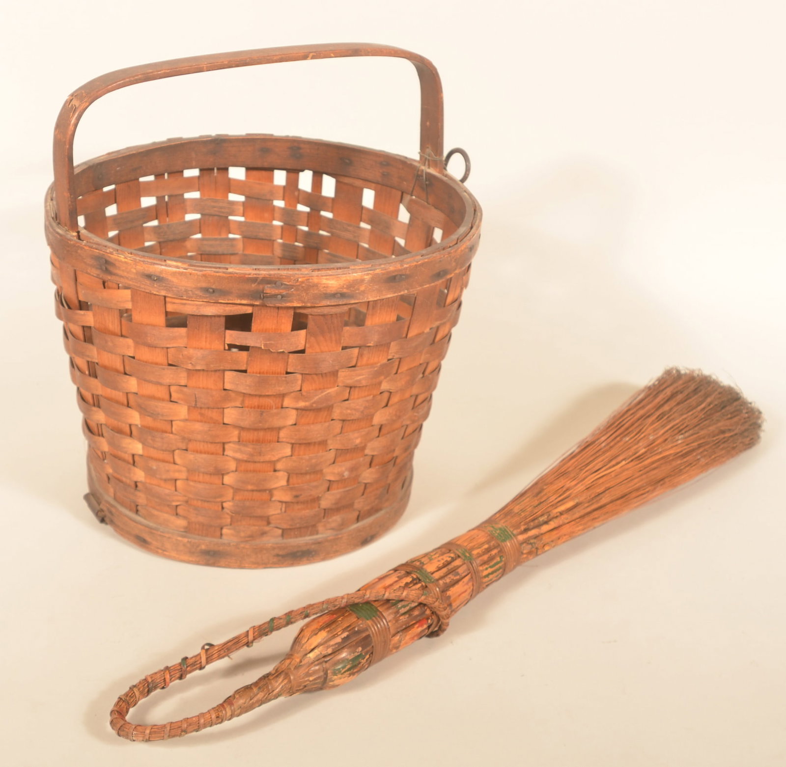 Signed Enfield Maine Penobscot Indian Apple Basket: Uncommon apple basket stamped on the wood base "Albert J. Nicola Enfield Maine Genuine Penobscot Indian Baskets". Wood handle stamped "Pat Pending". Body of the basket is ash with a wood bottom that h