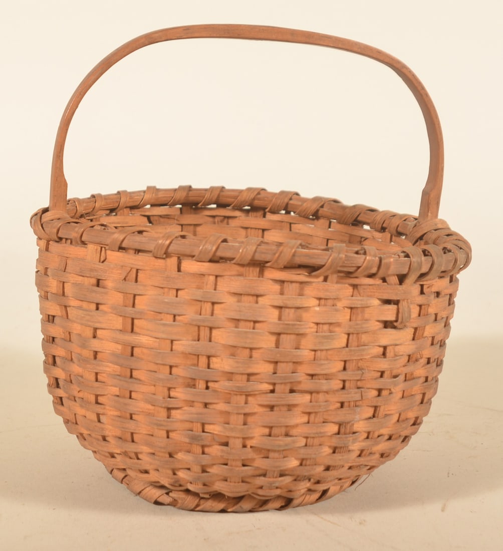 Dainty Size Antique Splint Oak Berry Basket: Wonderful carved handle with notches at either end. Splint oak body with tight braiding around the bottom band. 9"H x 7 1/2"D