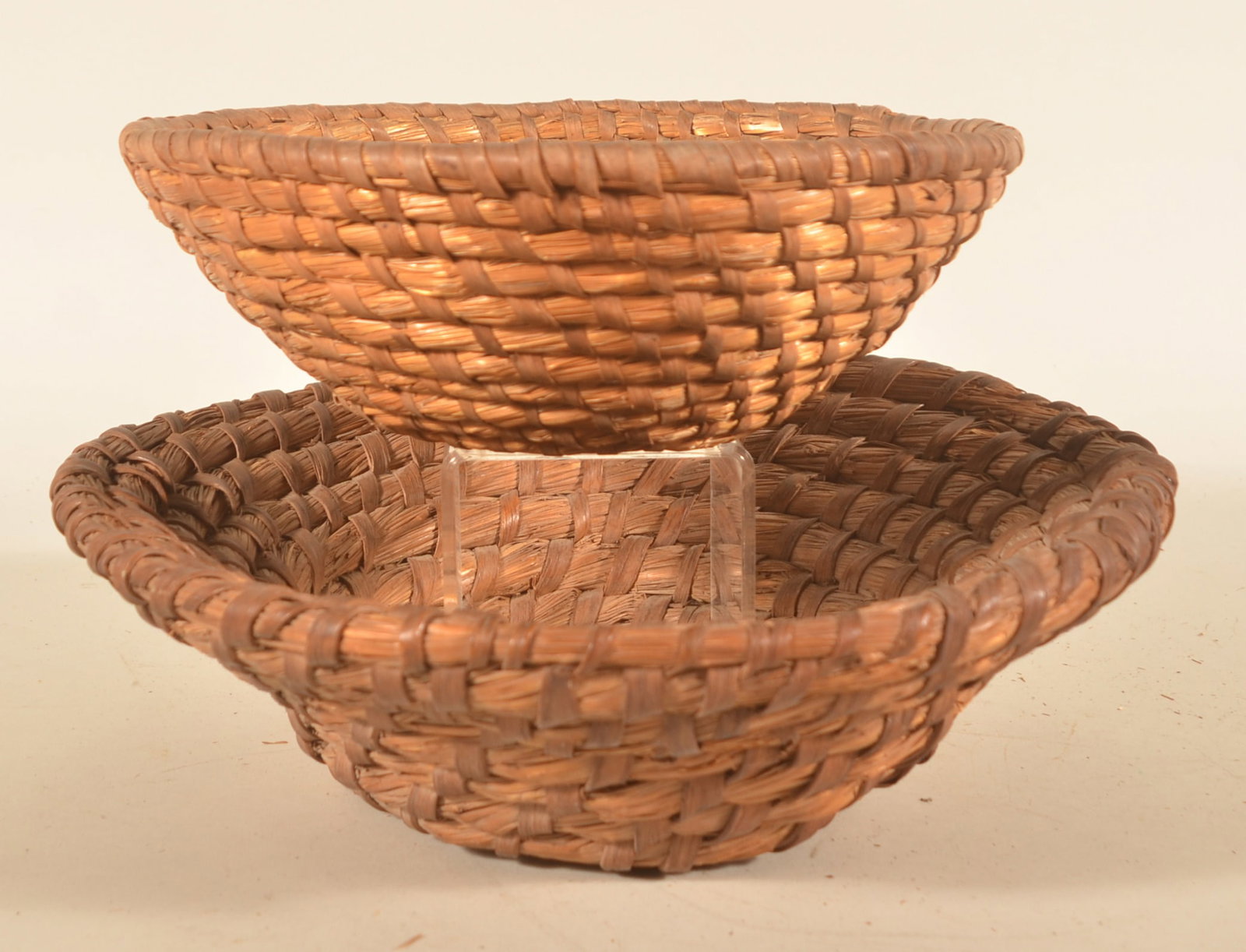 Two Antique Pennsylvania Rye Straw Baskets: Two different-size baskets, larger with an usual bell shape and the smaller in a traditional bowl form. Larger basket, 4 1/2"H x 14 1/4"D
