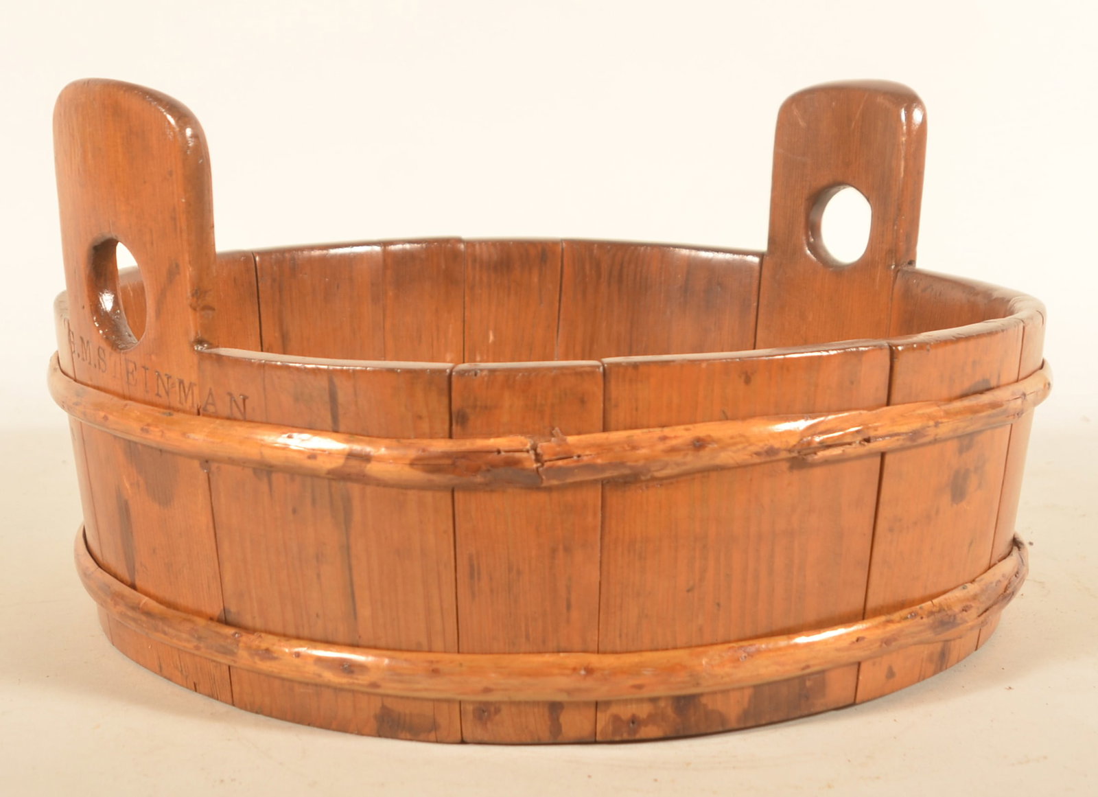 Signed Steinman Lancaster, PA Wood Wash Tub: Small wood banded wash tub with cut-out handles. Stamped on side "G.M.S. Steinman". George M. Steinman (1847-1920) owned a hardware store on West King Street in Lancaster City. The building still stan