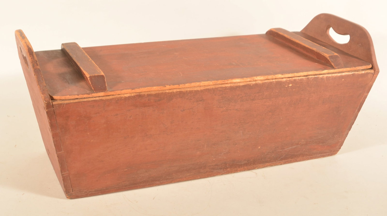 Excellent PA Red-Painted Dovetailed Dough Tray: Pennsylvania dough tray with cut-out handles and dovetailed body. Original red paint with excellent surface and wear. 13 3/4"H x 33"W x 13 1/2"D