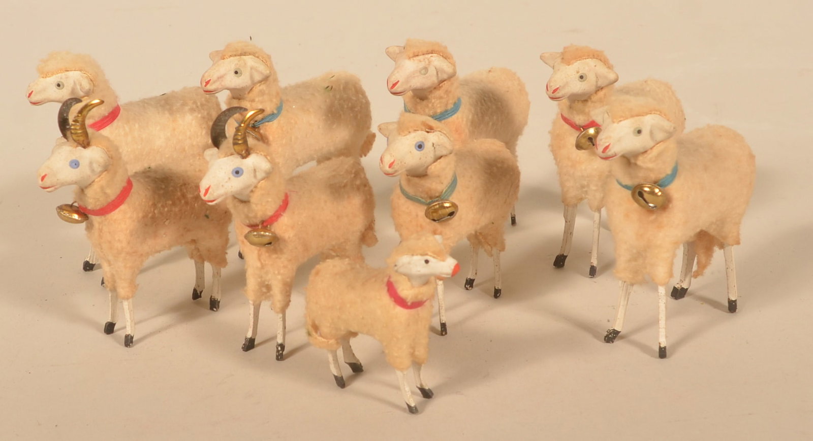 Collection of Antique Putz German Stick Sheep: Two rams, one small sheep marked Germany on the leg and six large sheep, each with bells on. Nine total. Rams, 3 3/4"H x 3"L