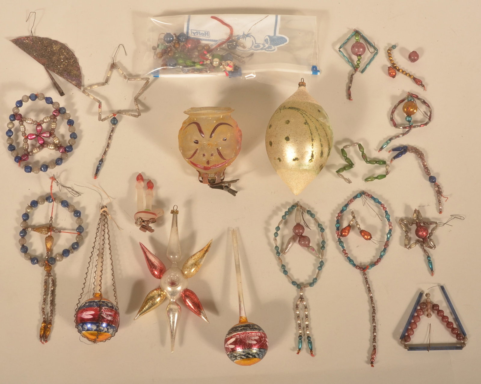 Small Collection Antique Glass Christmas Ornaments: Nice group including a figural clip on ornament with a man's face, small hanging beaded ornaments and extra pieces. Longest, 6"
