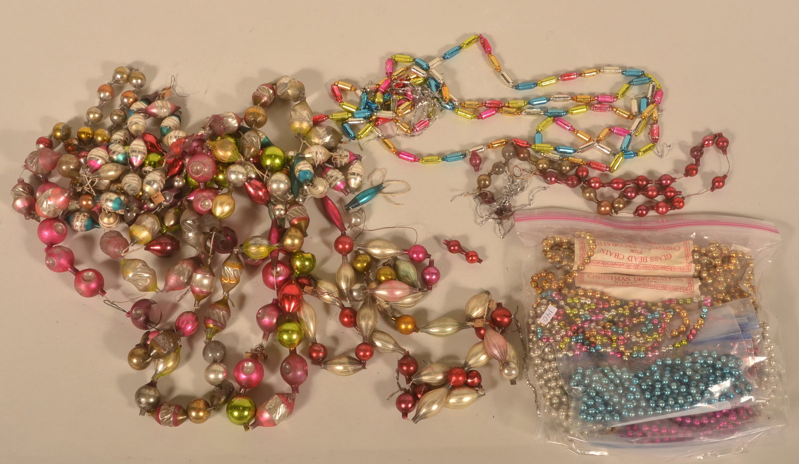Antique Glass Christmas Tree Garland: Nice group of garland including some early German strands and later 8-foot chain still in the packaging.