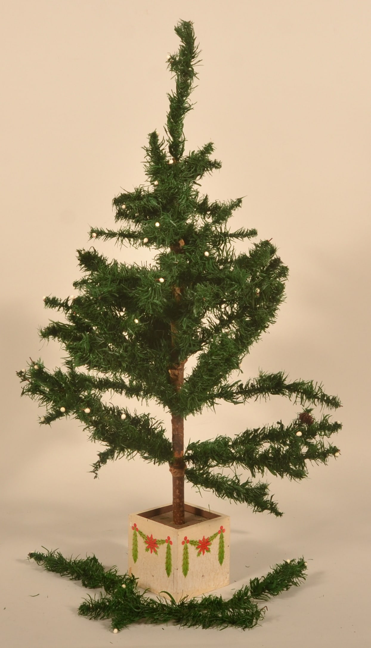 36" Antique German Feather Tree: Square base with applied decoration. Partial stamp on base ends with "Exclusively for Macy's". 1930s. 36"H