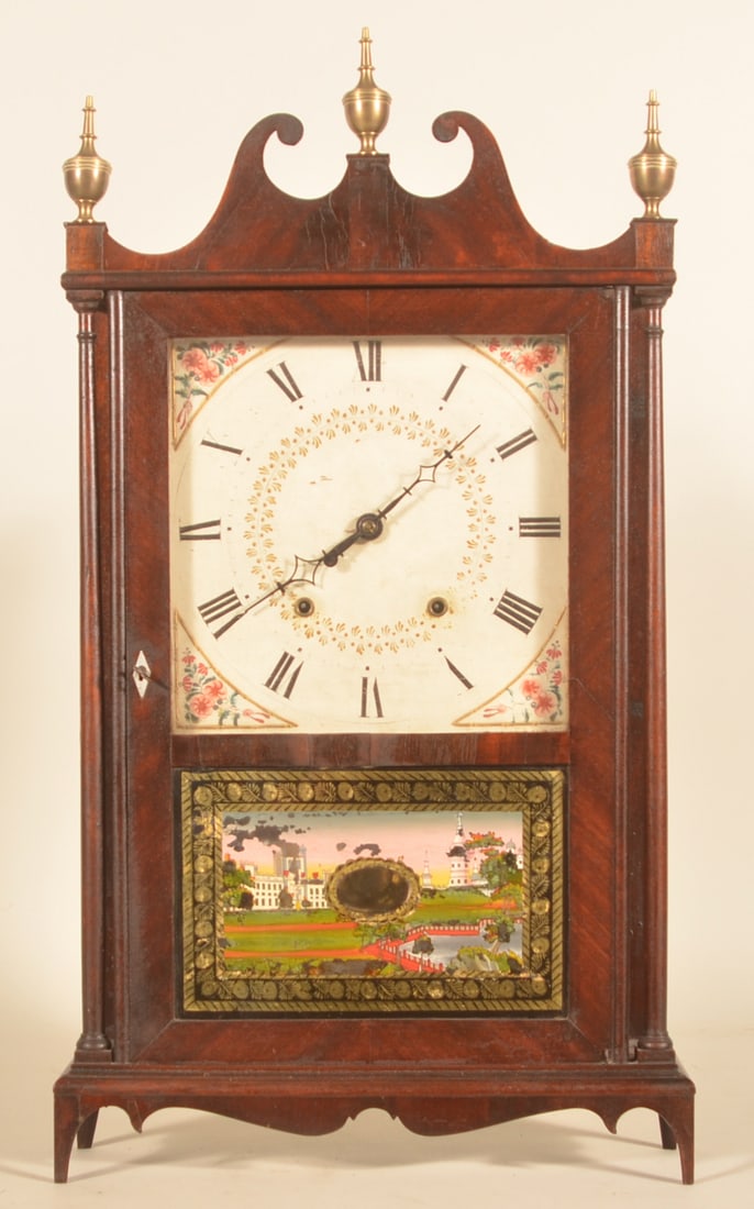 E. Terry & Sons Pillar & Scroll Mantle Clock: Wonderful example of a difficult to find clock featuring a complete maker's label on the inside. Mahogany veneer case with scrolled Chippendale-style pediment, delicate bracket feet, cyma-curved apron