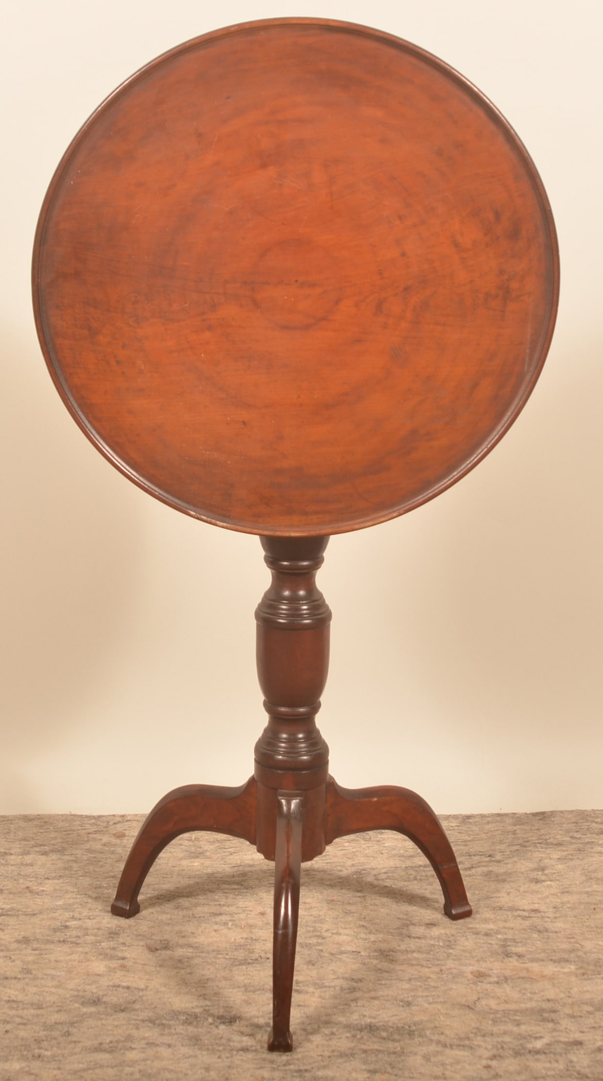 Early Mahogany Tilt-Top Candlestand: Wonderful patina and form. Raised lip on the top, nicely turned column and shaped legs ending in a square base. 28 3/4"H x 20 1/4"D