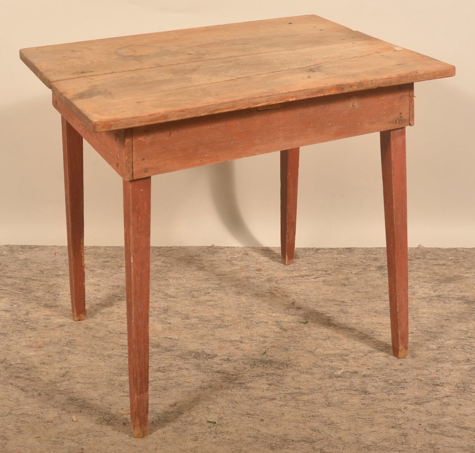 2-Board Scrub-Top Work Table: Simple country table. Skirt and legs in original red paint. Pine with square nails. Late-19th century. Provenance: The collection of Russell and Darlene Snyder. 29 3/4"H x 32"W x 23"D
