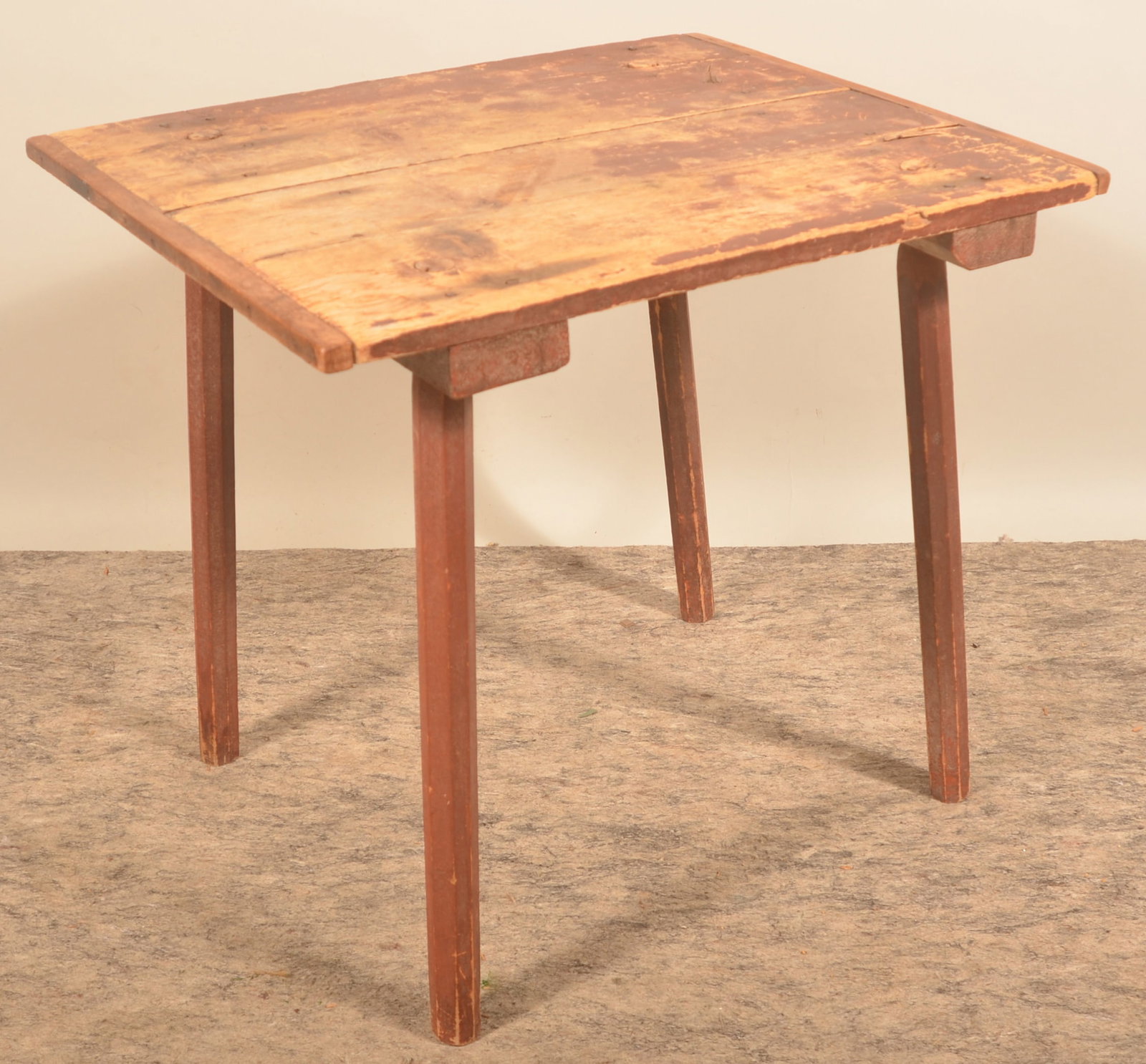 Early Red-Painted Carved Leg Table: 2-board top with bread board ends, four carved legs, mortised and wedged, square nail construction. Original red paint. Nice small work table. 27" x 29 1/2" x 23 1/2"