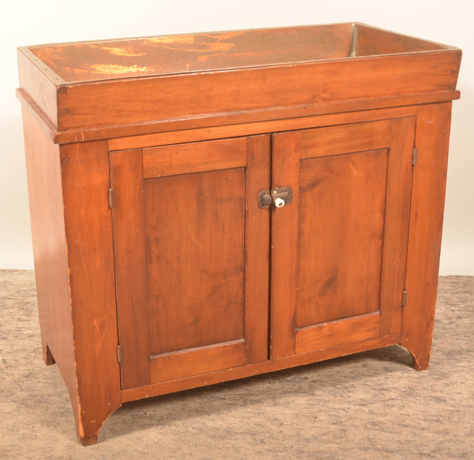 Small 2-Door Sheraton-Style Dry Sink: Berks County, Pa. dry sink with copper liner, bracket feet, recessed-panel doors and dovetailed well. 32 1/2"H x 37"W x 18 1/2"D