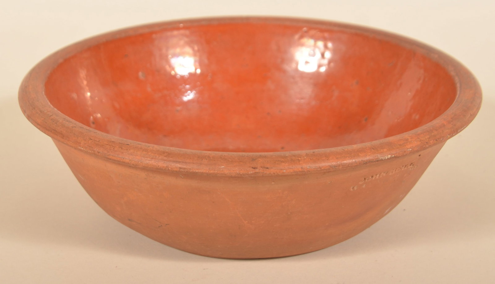 John Bell Waynesboro, PA Redware Bowl: Nice small bowl with bright interior glaze. Impressed "John Bell Waynesboro". 9 3/4" diam.