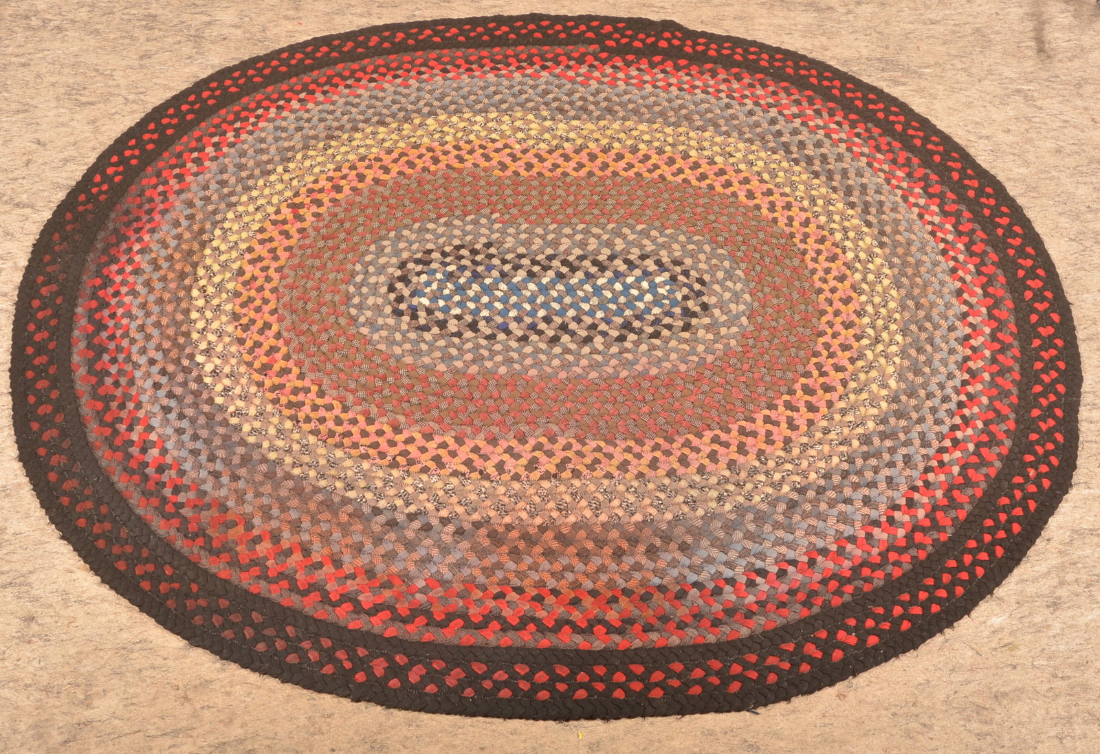 62" x 76" Handmade Braided Rug: Nice dark colors and manageable size. Early-20th century. 62" x 76"