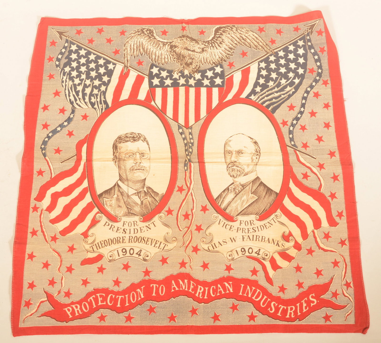 1904 Teddy Roosevelt Campaign Handkerchief: Excellent example from the 1904 US Presidential election. Handkerchief features Republican Theodore Roosevelt and his running mate Chas Fairbanks. Wonderful patriotic motif. 22 3/4" x 23 3/4"