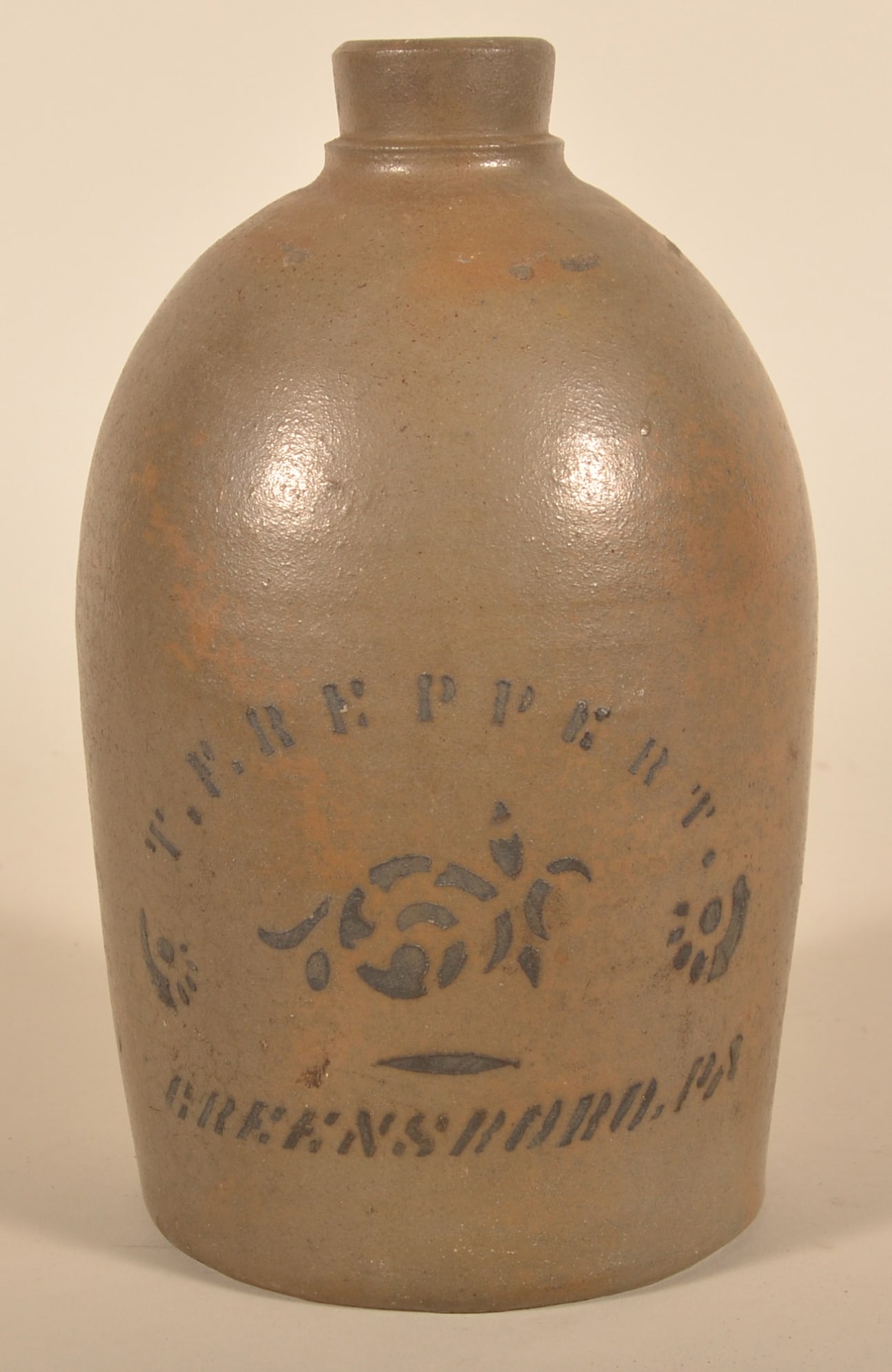 T.F. Reppert 1-Gallon Greensboro, PA Jug: Stenciled jug made at the pottery of T.F. Reppert in Greensboro, Pa. Ca. 1880. 11 1/2"H