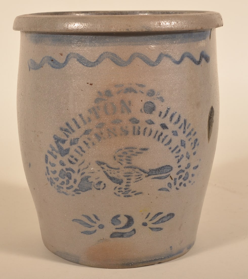 Hamilton & Jones Bird In Flight Stenciled Crock: 2-gallon wide mouth crock stenciled with the name, Greensboro, Pa and the capacity mark of "2". The bird in flight is a very nice stencil not often found on storage crocks. 10 3/8"H