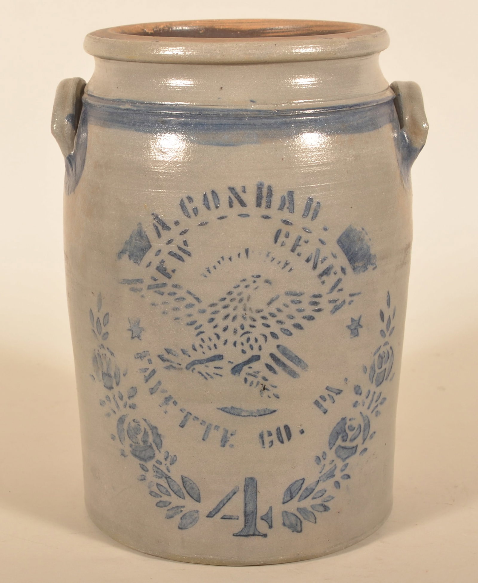 4-Gallon A. Conrad New Geneva Eagle Crock: Iconic stencil by Alexander Conrad featuring the spreadwing eagle facing right over two stars and "Fayette Co. Pa.". Stenciled roses and the capacity number along with freehand embellishments under