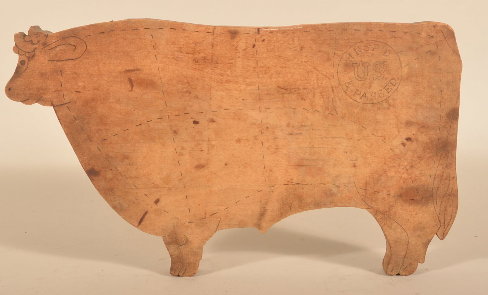Great Folk Art Figural Maple Bull Cutting Board: 1 1/4" thick maple engraved with the details of the cow and "Insp'd US & Passed" in the upper right. 19 1/2"L