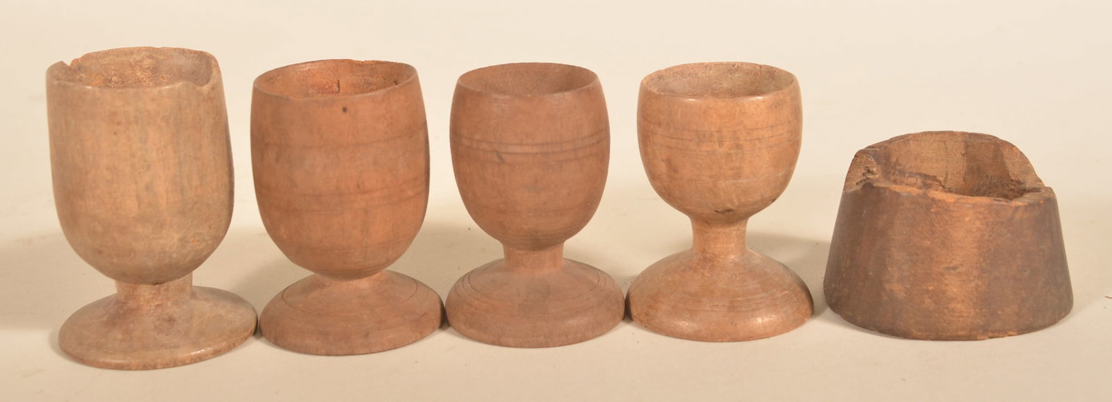 Group of Early Turned Wood Egg Cups: Five items total. Descended in a Berks County, Pa. family. Shortest one with breaks along top edge and no base. Tallest, 3"H