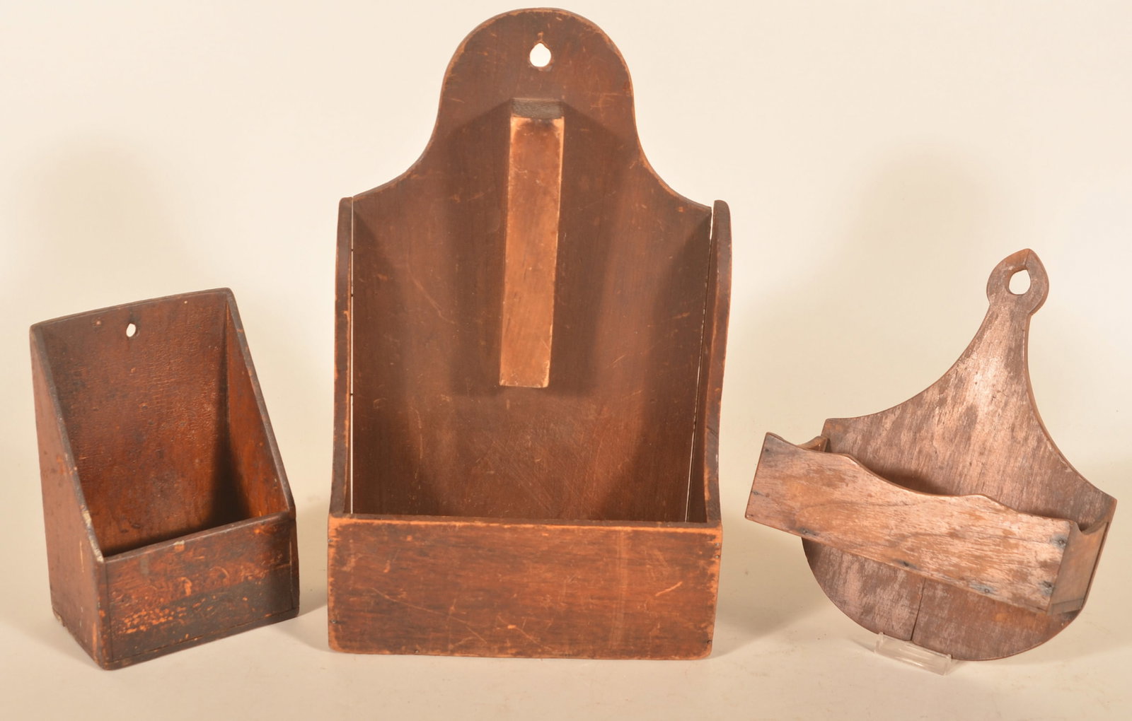 Group of Late-19th C. Primitive Wood Wall Boxes: Three late-19th-century wood wall boxes, each with the original surface and graduated in size. The first is a scrub box with a nicely shaped crest and sides. The second also has a very nice shaped