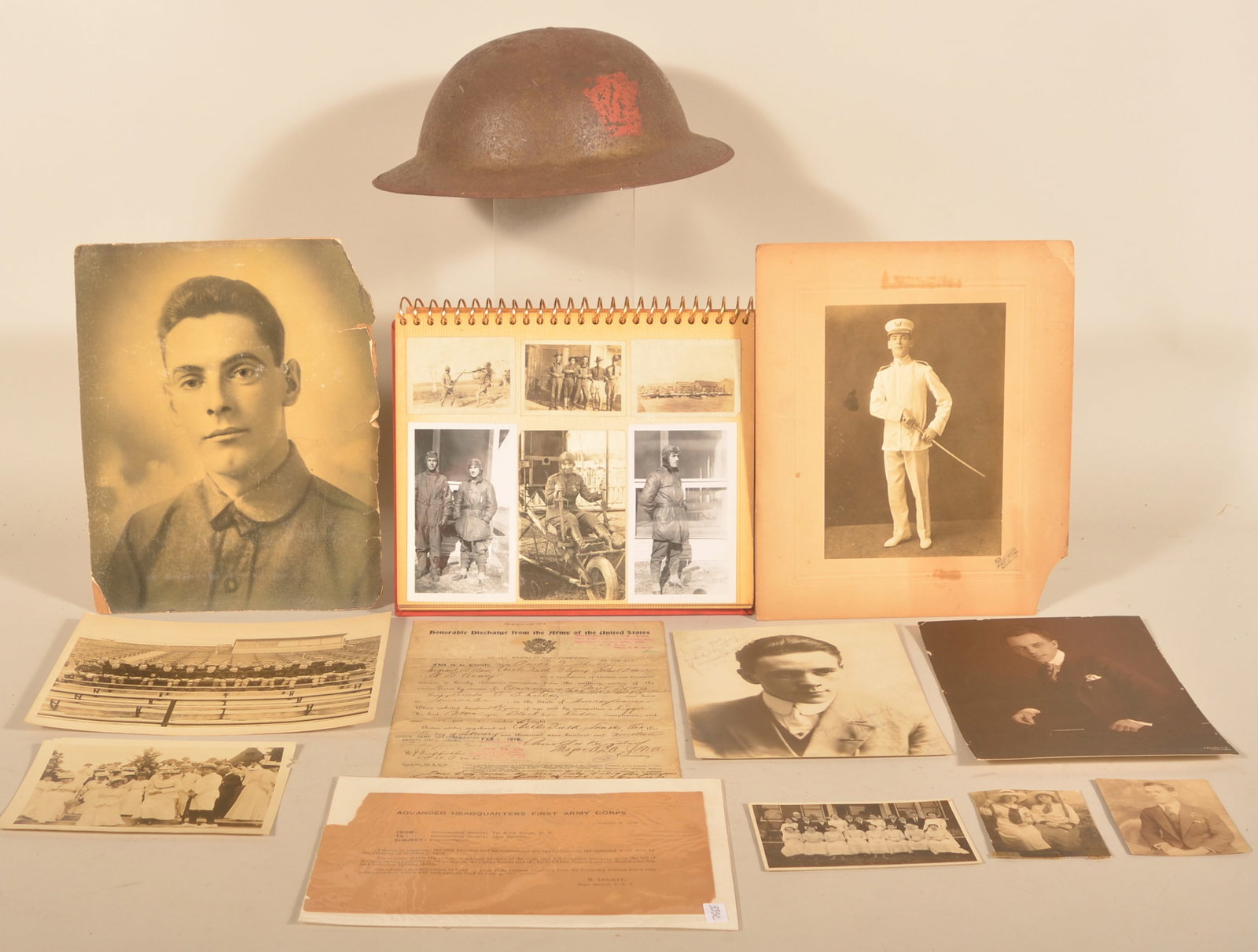 WWI 28th Div. Painted Helmet, Documents, Photos: Standard US Army WWI helmet painted with the red Keystone representing the 28th Division, swivel bails and interior leather straps. Together with a printed document dated October 8, 1918 from the comm