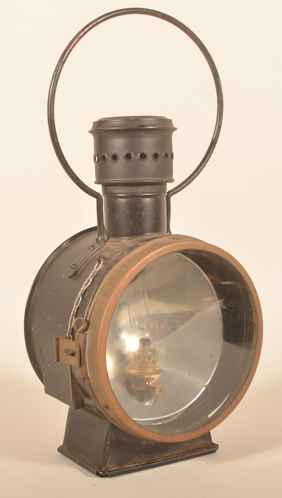 Unger Steam Train Engine Headlamp: Includes burner marked Kosmos Brenner. Stamped Unger on underside of base. Very nice example. Provenance: The collection of Russell and Darlene Snyder. 21"H x 10 1/2"W x 7"D