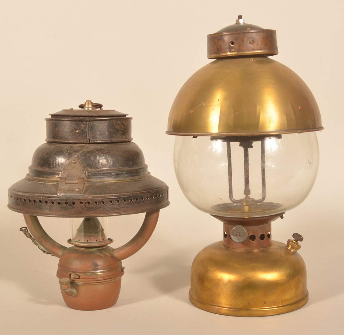 Marine Trawler & Arc Lanterns: Group of two lanterns. Marine Trawler lantern marked "Made in England". Very nice Arc lamp in brass unmarked. Provenance: The collection of Russell and Darlene Snyder. Arc lamp, 19"H