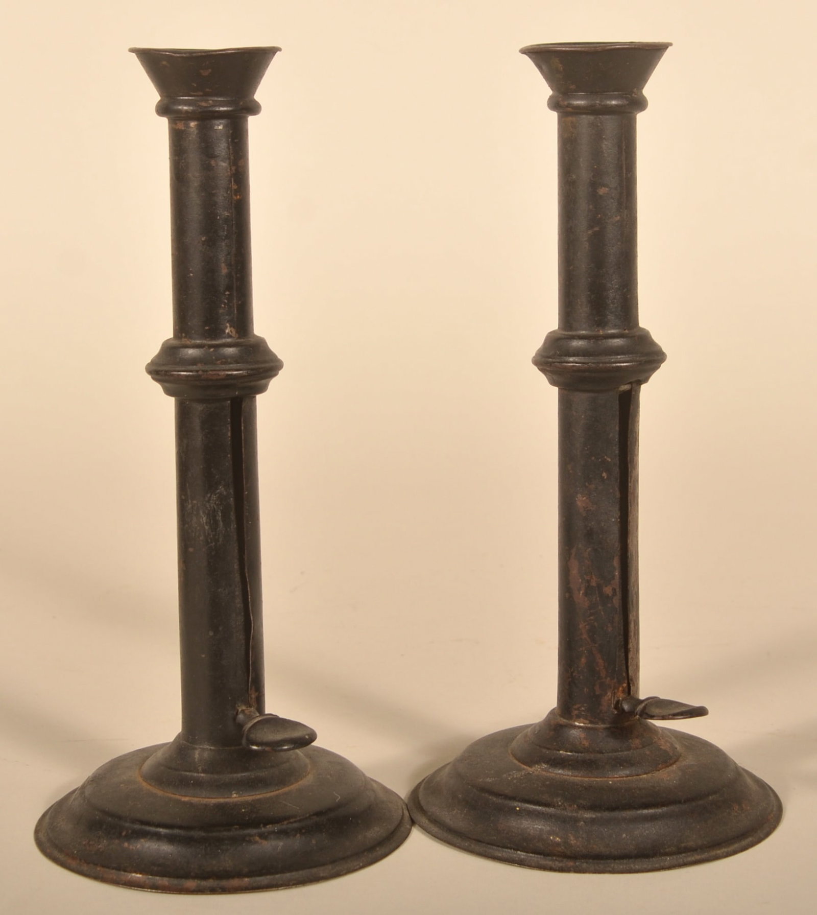 Antique Pair of Iron Push-Up Candlesticks: Mid-19th century with a later black paint. 10"H