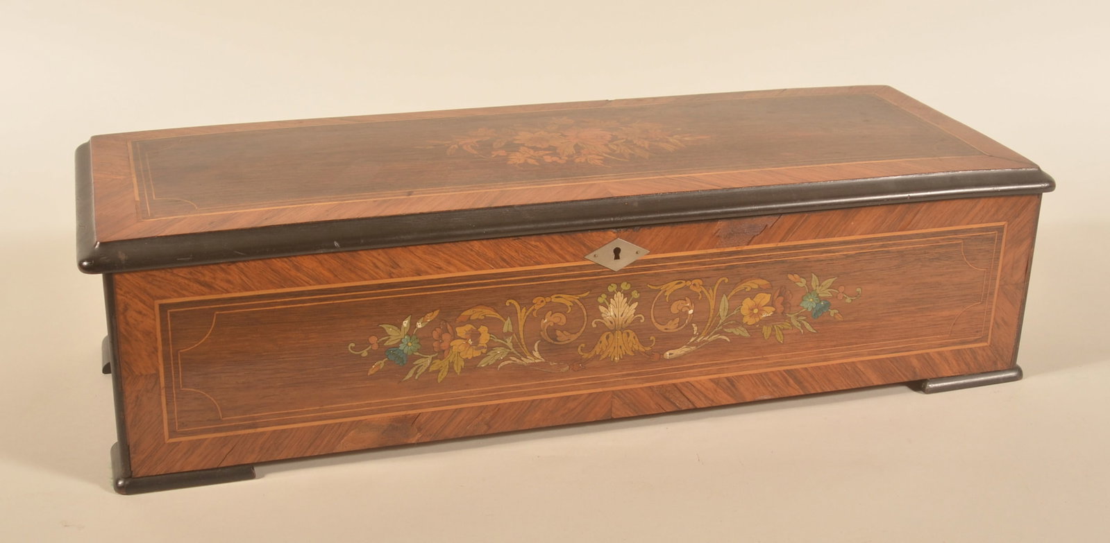 Antique 10-Play Swiss Music Box: 19th-century Swiss music box with serial number 62936 on handle. Working condition. Receipt from being worked on dated 8-3-1976. 7"H x 26 1/2"W x 10"D