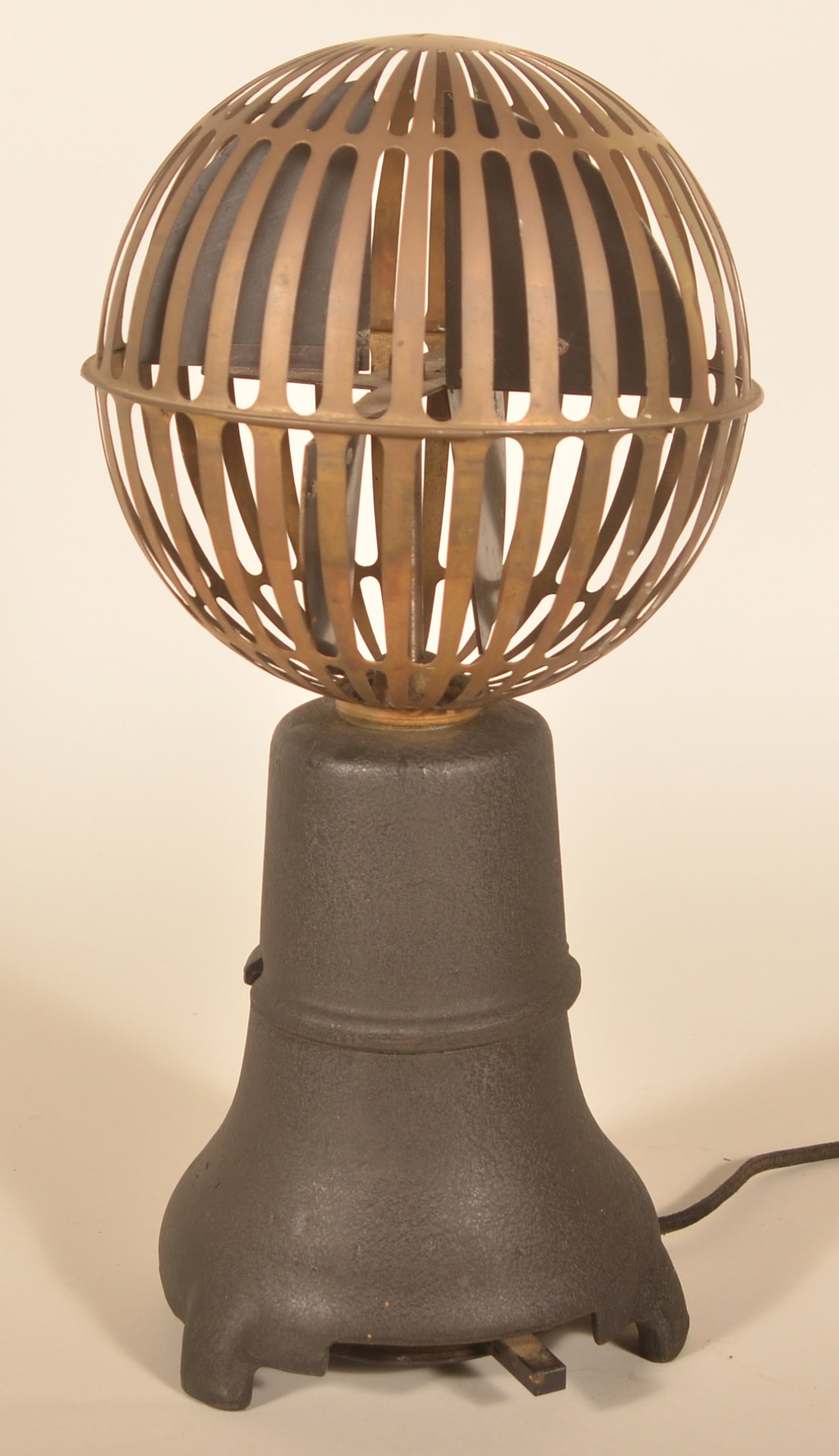 Art Deco Cast Iron Bankers Savory Airator Desk Fan: Wonderful 1930s form with a brass cage, cast iron base and metal fan blades that would amputate your arm if it weren't for the cage. These were used in banks around the teller's window and on desks.