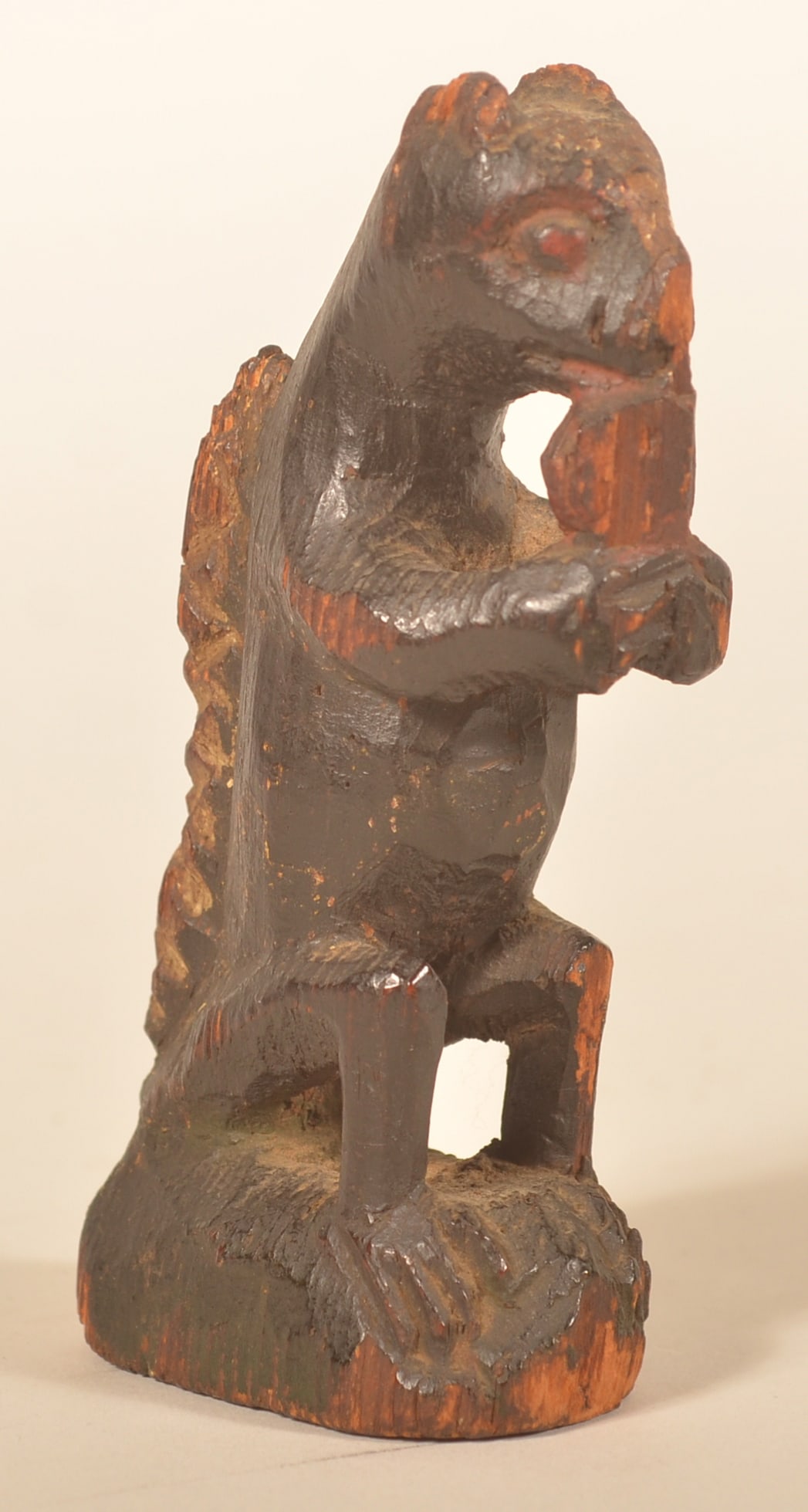 Carved & Painted Schimmel Squirrel w/ Provenance: Wilhelm Schimmel (?-1890) carved and painted seated squirrel with cross-hatched tail, holding a nut in his claws. Purchased from the Sotheby's auction of the Mr. & Mrs. James O Keene collection in