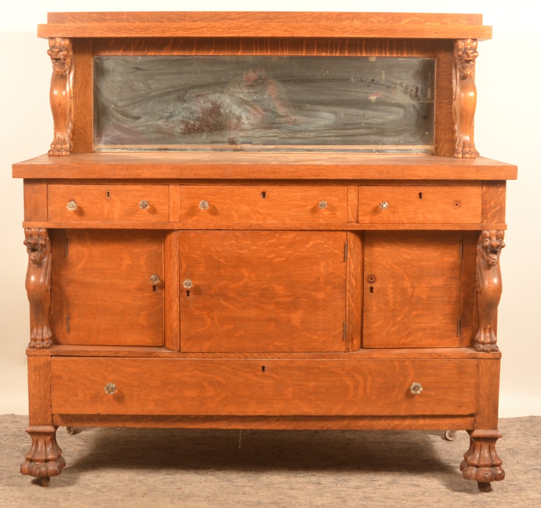 Antique Tiger Oak Server w/ Carved Lions: Impressive buffet with two full-body lions supporting the upper shelf and lion's paw feet. Original beveled mirror and dovetailed drawers. 60"H x 60"W x 24"D