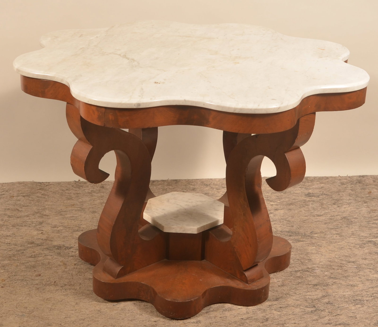 Antique Marble-Top Parlor Table: Empire period carved mahogany veneer base with scalloped marble top and small marble center piece. 29 1/2"H x 42 1/2"D