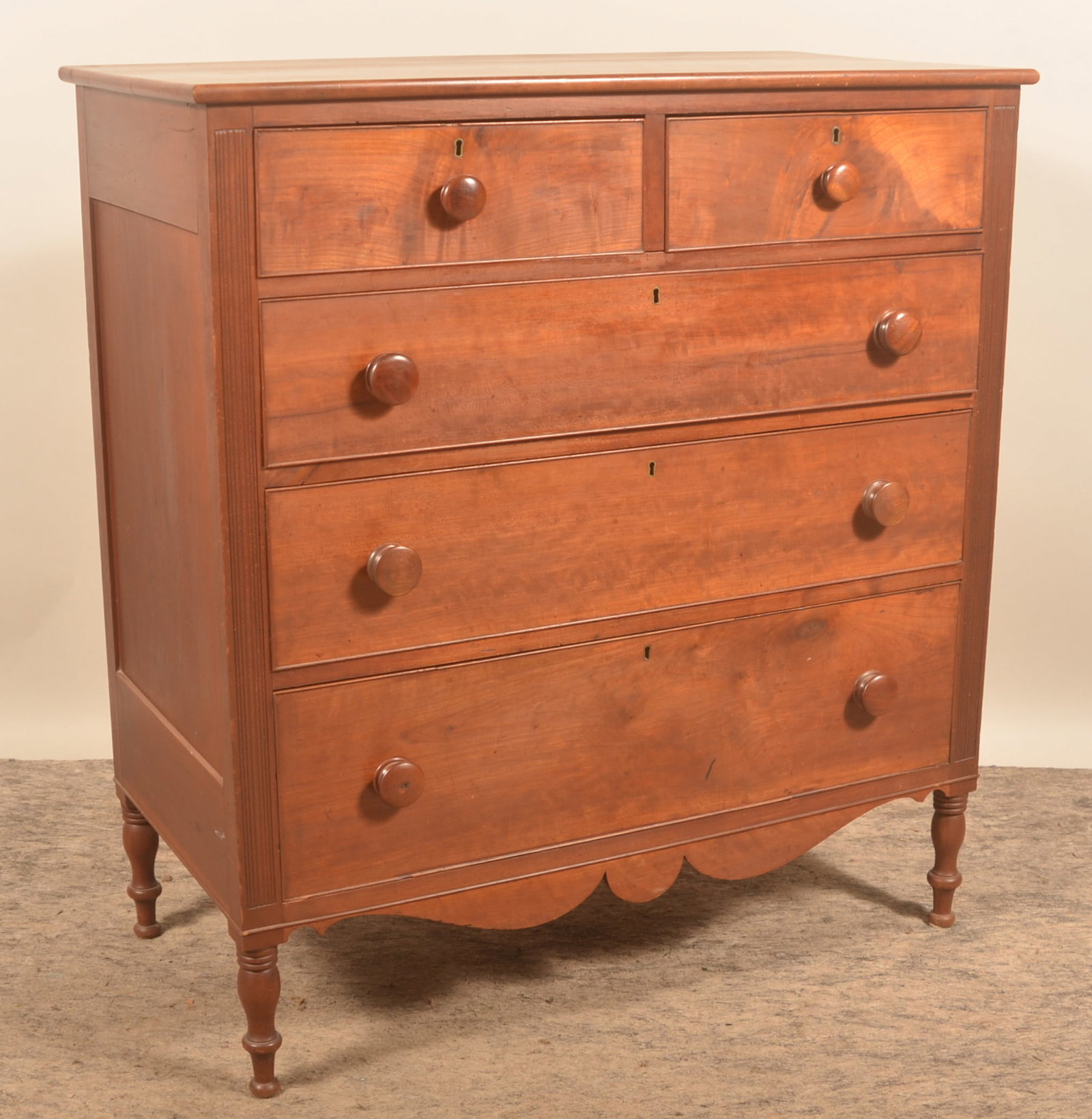 Sheraton Cherry Chest of Drawers: Clean two over three chest of drawers from a family in Hamburg, Berks County, Pa. Dovetailed drawers, shaped apron, turned legs and reeded returns. Ready to use. 45 1/2"H x 42"W x 21 1/2"D