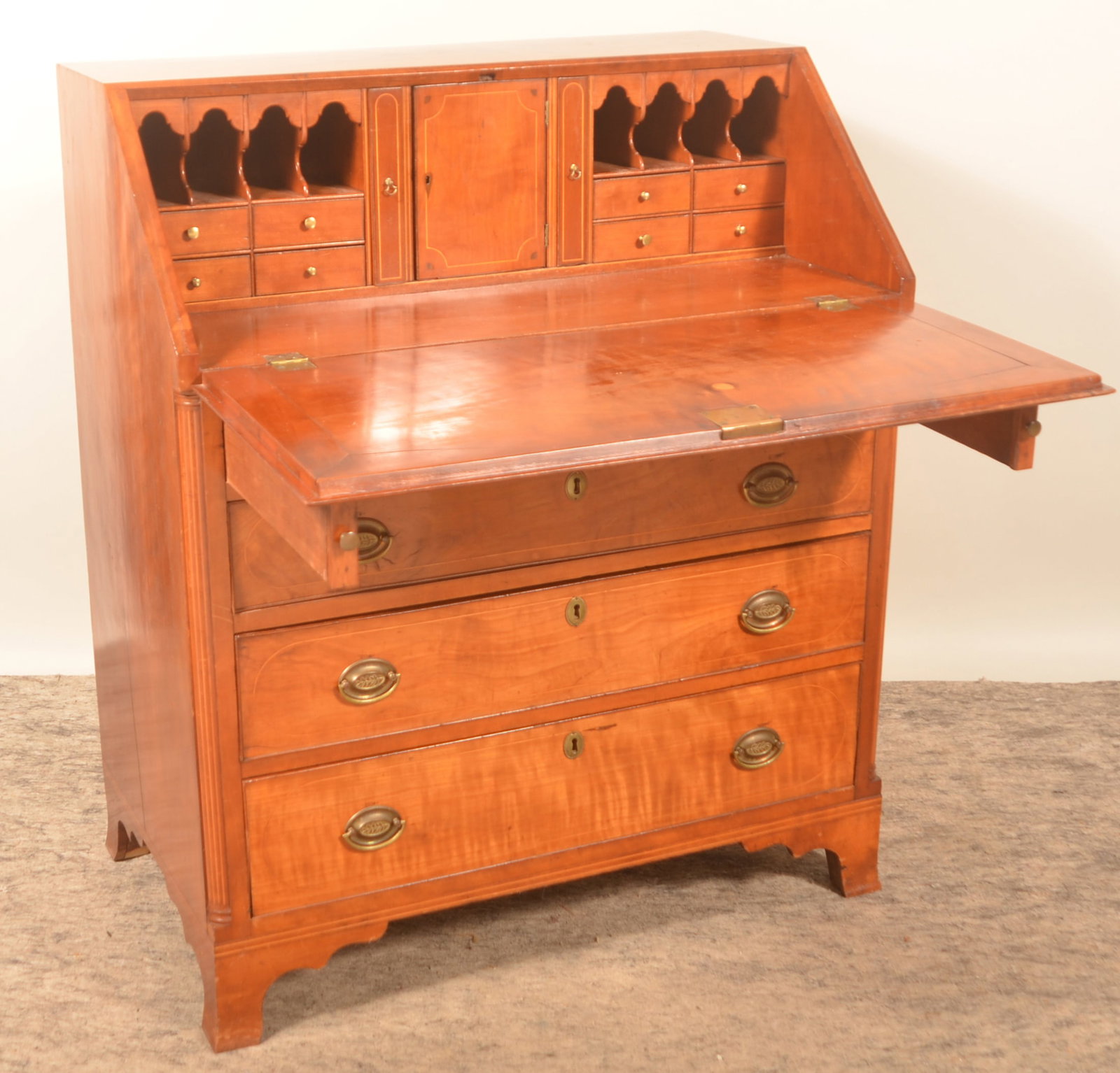 Early Inlaid Slant Front Desk: Mahogany slant front desk with delicate inlay and fluted columns. Four dovetailed drawers, fall front reveals interior drawers. French feet. 42 3/4"H x 36"W x 21 1/2"D