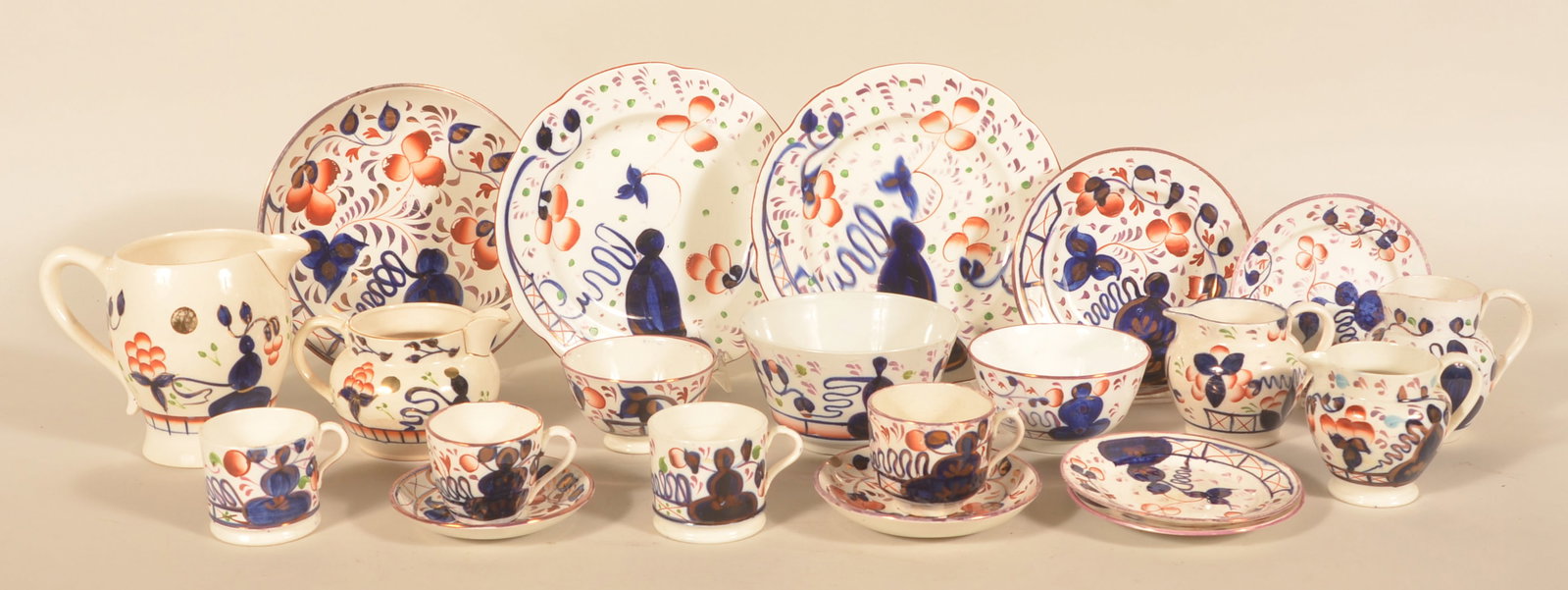 Collection of Staffordshire Gaudy Welsh China: A visually appealing collection of oyster pattern Gaudy Welsh, some marked England. Mid-19th century. The group consists of 5 different-size creamers and pitchers, 2 mugs, 3 different-size bowls, 2 cu