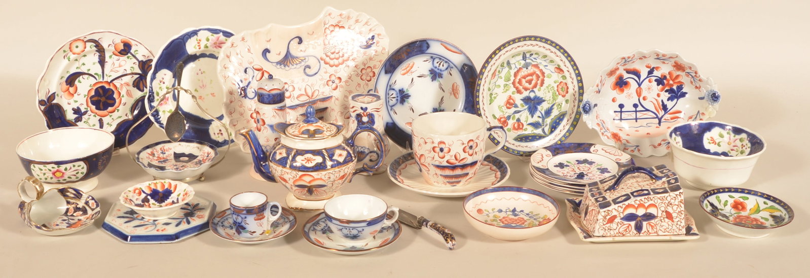 Antique English Gaudy Welsh: A nice group of Gaudy Welsh with different patterns. Visually beautiful China that looks great in a cupboard. 13 different plates and saucers, 3 small bowls, 2 cups, teapot marked Price Kensington, li