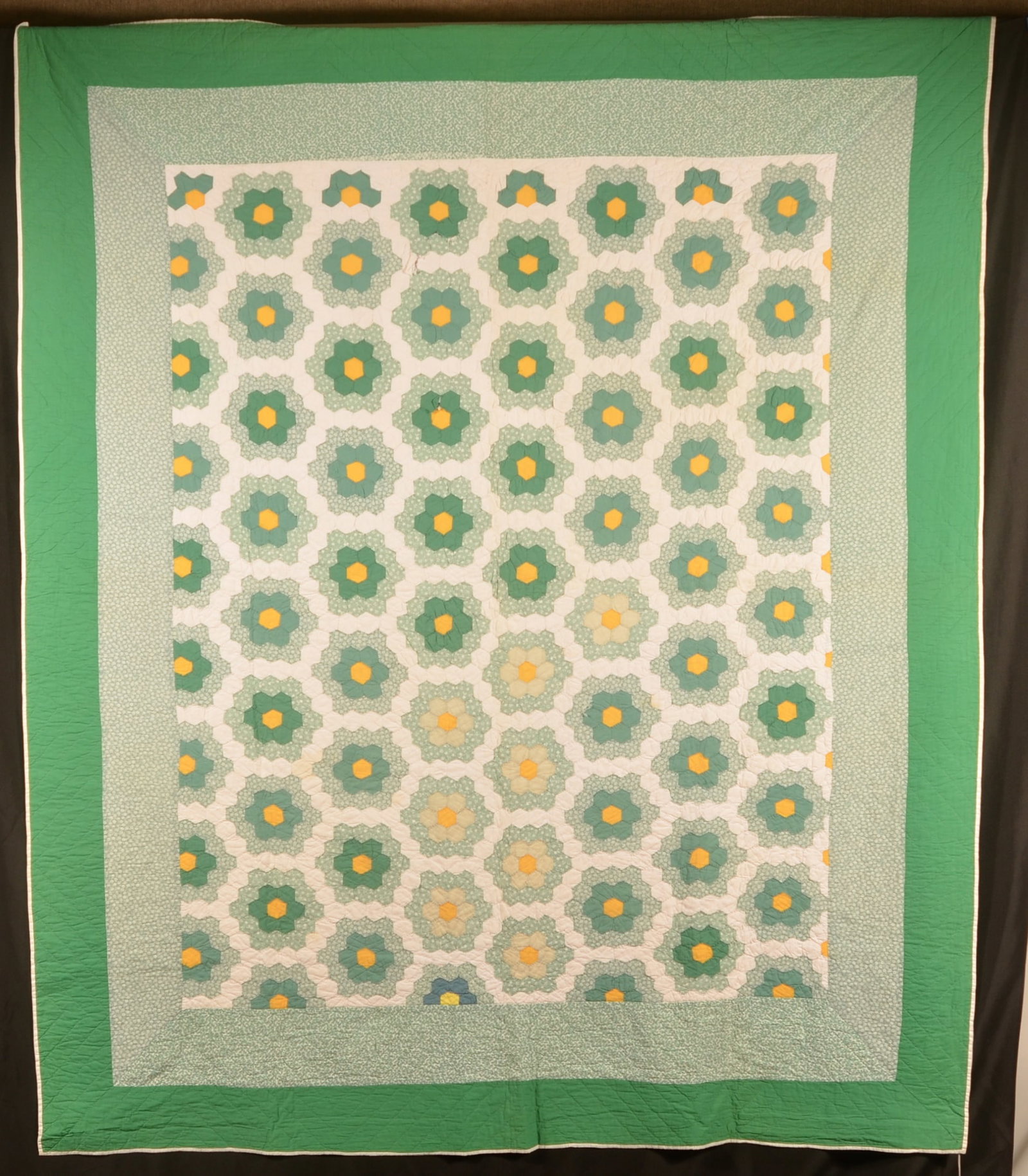 1940s Dresden Plate Vintage Quilt: Hand and machine-stitched quilt with various shades of green, yellow and white. 95" x 80"