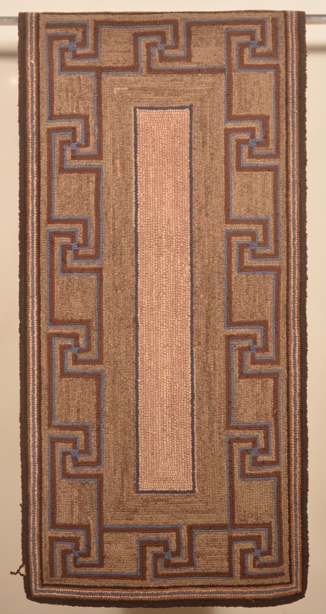 Antique Pennsylvania Hooked Rug: Sharp 1920s hooked rug in earthy tones, shows very well. 27" x 56"